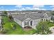 A home features a lush lawn and landscaping at 4224 Crayford Ct, Land O Lakes, FL 34638