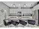 Modern kitchen featuring granite countertops, stainless steel appliances, and a large island with bar seating at 4224 Crayford Ct, Land O Lakes, FL 34638