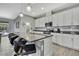 Stylish kitchen with granite counters, stainless steel appliances, and bar seating at 4224 Crayford Ct, Land O Lakes, FL 34638