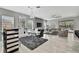 Open-concept living area with tile floors, contemporary décor, and abundant natural light at 4224 Crayford Ct, Land O Lakes, FL 34638