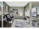 Comfortable living room offers a relaxed setting with leather seating and entertainment center at 4224 Crayford Ct, Land O Lakes, FL 34638