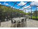 Outdoor dining and bar on the screened patio of this inviting home at 4224 Crayford Ct, Land O Lakes, FL 34638