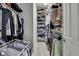 Walk-in closet with custom shelving and hanging racks, designed for optimal organization at 4224 Crayford Ct, Land O Lakes, FL 34638
