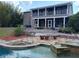 Beautiful backyard featuring a covered patio and water feature, perfect for relaxing and entertaining at 4702 Cypress Serenity Dr, Plant City, FL 33565