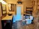 Rustic bathroom features vessel sink, wood accents, and modern fixtures at 4702 Cypress Serenity Dr, Plant City, FL 33565