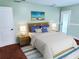 Bedroom features light green walls, white doors, and a nautical theme at 4702 Cypress Serenity Dr, Plant City, FL 33565
