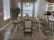 Formal dining room boasts natural light and modern chandelier at 4702 Cypress Serenity Dr, Plant City, FL 33565