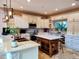 Kitchen features a central island, pendant lighting, and ample cabinet space at 4702 Cypress Serenity Dr, Plant City, FL 33565