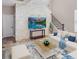 Bright living room features a stone accent wall and staircase at 4702 Cypress Serenity Dr, Plant City, FL 33565