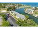 A waterfront condo building with boat docks, parking, and lush landscaping by the canal at 4740 Beach Se Dr # A, St Petersburg, FL 33705