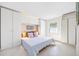Cozy bedroom with built-in wardrobes, stylish bedding, and ample natural light at 4740 Beach Se Dr # A, St Petersburg, FL 33705