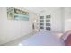Bright bedroom with a view of the kitchen through glass paneled doors at 4740 Beach Se Dr # A, St Petersburg, FL 33705