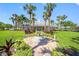 Beautiful clubhouse with a fountain, landscaping, and palm trees at 4740 Beach Se Dr # A, St Petersburg, FL 33705
