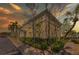 Exterior view of the community clubhouse, featuring well-maintained landscaping and ample parking at 4740 Beach Se Dr # A, St Petersburg, FL 33705