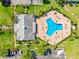 Overhead shot of a modern community pool with plenty of lounge chairs and palm trees at 4740 Beach Se Dr # A, St Petersburg, FL 33705