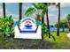 Coquina Key community sign with palm trees and well manicured landscaping on a bright sunny day at 4740 Beach Se Dr # A, St Petersburg, FL 33705