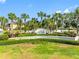 Waterside community entrance featuring lush landscaping, mature palm trees, and attractive signage at 4740 Beach Se Dr # A, St Petersburg, FL 33705