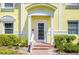 Charming yellow condo building with classic architectural details, well-maintained landscaping at 4740 Beach Se Dr # A, St Petersburg, FL 33705