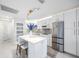 Contemporary kitchen featuring stainless steel appliances, island, and custom cabinetry at 4740 Beach Se Dr # A, St Petersburg, FL 33705