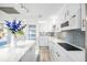 Modern kitchen with an island, sleek countertops, and stylish backsplash at 4740 Beach Se Dr # A, St Petersburg, FL 33705