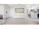 Bright entryway leads to a modern kitchen with an island and breakfast bar at 4740 Beach Se Dr # A, St Petersburg, FL 33705