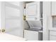 Close up view of a modern, stacked washer and dryer laundry unit at 4740 Beach Se Dr # A, St Petersburg, FL 33705