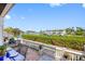 Scenic patio with a dining set and grill overlooking the waterfront, great for outdoor dining and gatherings at 4740 Beach Se Dr # A, St Petersburg, FL 33705