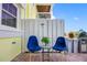 Cozy outdoor seating area with blue chairs and a small table, ideal for relaxing and enjoying the weather at 4740 Beach Se Dr # A, St Petersburg, FL 33705