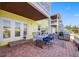 Charming outdoor patio with waterfront views, dining table, blue accents and lush foliage at 4740 Beach Se Dr # A, St Petersburg, FL 33705