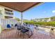 Charming outdoor patio with waterfront views, dining table, blue accents and lush foliage at 4740 Beach Se Dr # A, St Petersburg, FL 33705