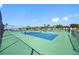 Community tennis courts surrounded by trees and green turf at 4740 Beach Se Dr # A, St Petersburg, FL 33705