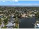 Beautiful aerial view of the property with water frontage and neighboring docks and serene surroundings at 4790 Shore Acres Ne Blvd, St Petersburg, FL 33703