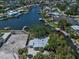 Aerial view of a waterfront property featuring mature shade trees at 4790 Shore Acres Ne Blvd, St Petersburg, FL 33703