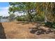 Beautiful backyard featuring mature trees and waterfront views, perfect for outdoor relaxation at 4790 Shore Acres Ne Blvd, St Petersburg, FL 33703