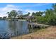 Waterfront view showcasing the dock and boat lift, great for accessing the open water at 4790 Shore Acres Ne Blvd, St Petersburg, FL 33703