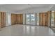 Spacious living room with tile floors offers natural light and a serene water view at 4790 Shore Acres Ne Blvd, St Petersburg, FL 33703
