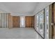 Spacious living room with tile floors offers natural light and a peaceful view at 4790 Shore Acres Ne Blvd, St Petersburg, FL 33703