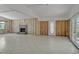Spacious living room featuring a fireplace, tile floors and great natural light at 4790 Shore Acres Ne Blvd, St Petersburg, FL 33703