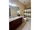 Bathroom with vanity, tile floor, and shower curtain at 5221 Bannister Park Ln, Lithia, FL 33547