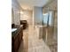 Bathroom featuring tile floors, a glass shower, and a soaking tub at 5221 Bannister Park Ln, Lithia, FL 33547