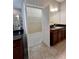 Bathroom with double vanity, tile floor and a walk-in closet at 5221 Bannister Park Ln, Lithia, FL 33547