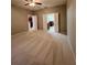 Spacious bedroom featuring neutral walls, carpet floors, and a ceiling fan at 5221 Bannister Park Ln, Lithia, FL 33547