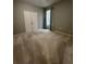 Empty bedroom with double doors and a large window at 5221 Bannister Park Ln, Lithia, FL 33547
