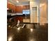 Gourmet kitchen featuring stainless appliances, granite counters, walk-in pantry, and a double basin sink at 5221 Bannister Park Ln, Lithia, FL 33547