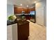 Updated kitchen featuring stainless appliances, granite counters, tile flooring and bright lighting at 5221 Bannister Park Ln, Lithia, FL 33547