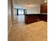 Open kitchen with tile floor, granite countertops, stainless steel appliances and a sink at 5221 Bannister Park Ln, Lithia, FL 33547