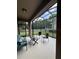 Relaxing screened patio featuring comfortable seating and outdoor furniture, perfect for enjoying the outdoors at 5221 Bannister Park Ln, Lithia, FL 33547