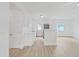 A modern kitchen with stainless steel appliances, white cabinets and an open floor plan at 5772 4Th N Ave, St Petersburg, FL 33710