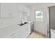 Contemporary kitchen with stainless steel sink, white countertops, and updated cabinets at 5772 4Th N Ave, St Petersburg, FL 33710