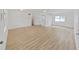 Bright living area features light wood flooring and an open layout, ready for modern living at 5772 4Th N Ave, St Petersburg, FL 33710